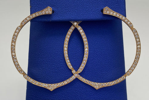 A pair of TEMPLATE hoop earrings from The DiamondLab with diamonds.