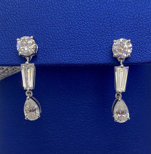 A pair of TEMPLATE earrings in a blue box from The DiamondLab.