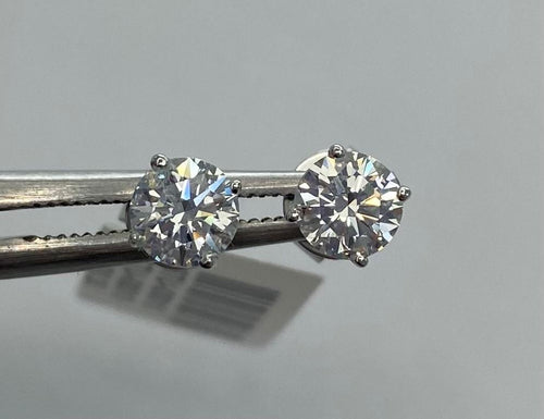 A pair of TEMPLATE diamond stud earrings with 4.1CT, 14KT WG from The DiamondLab.